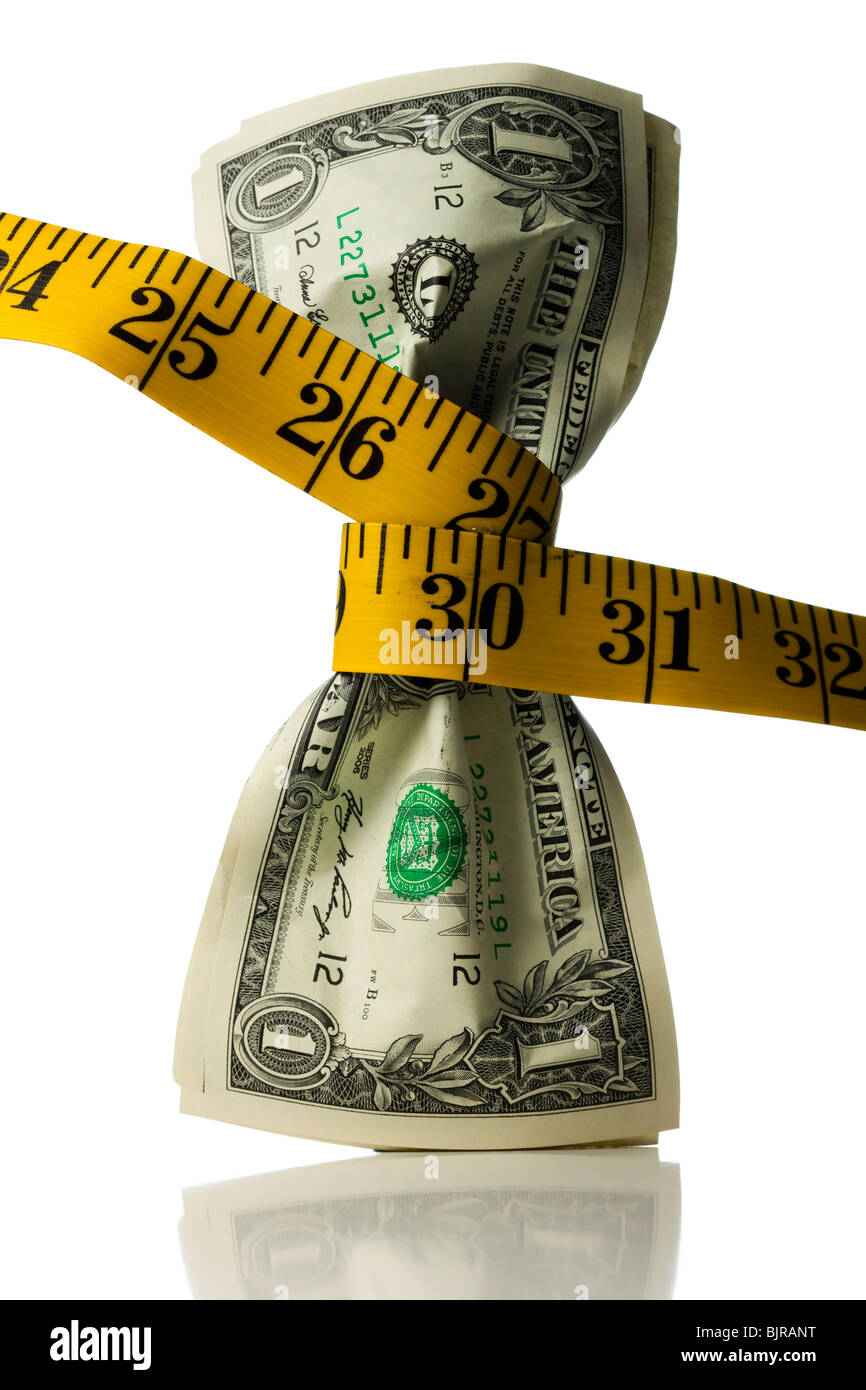 One dollar banknotes tied up with measuring tape against white background Stock Photo