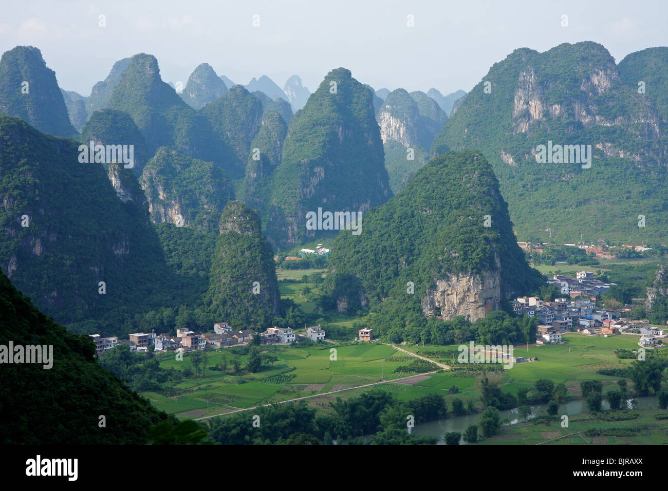 Limestone hills with rural settlements, Yangshou, Guangxi region, China Stock Photo