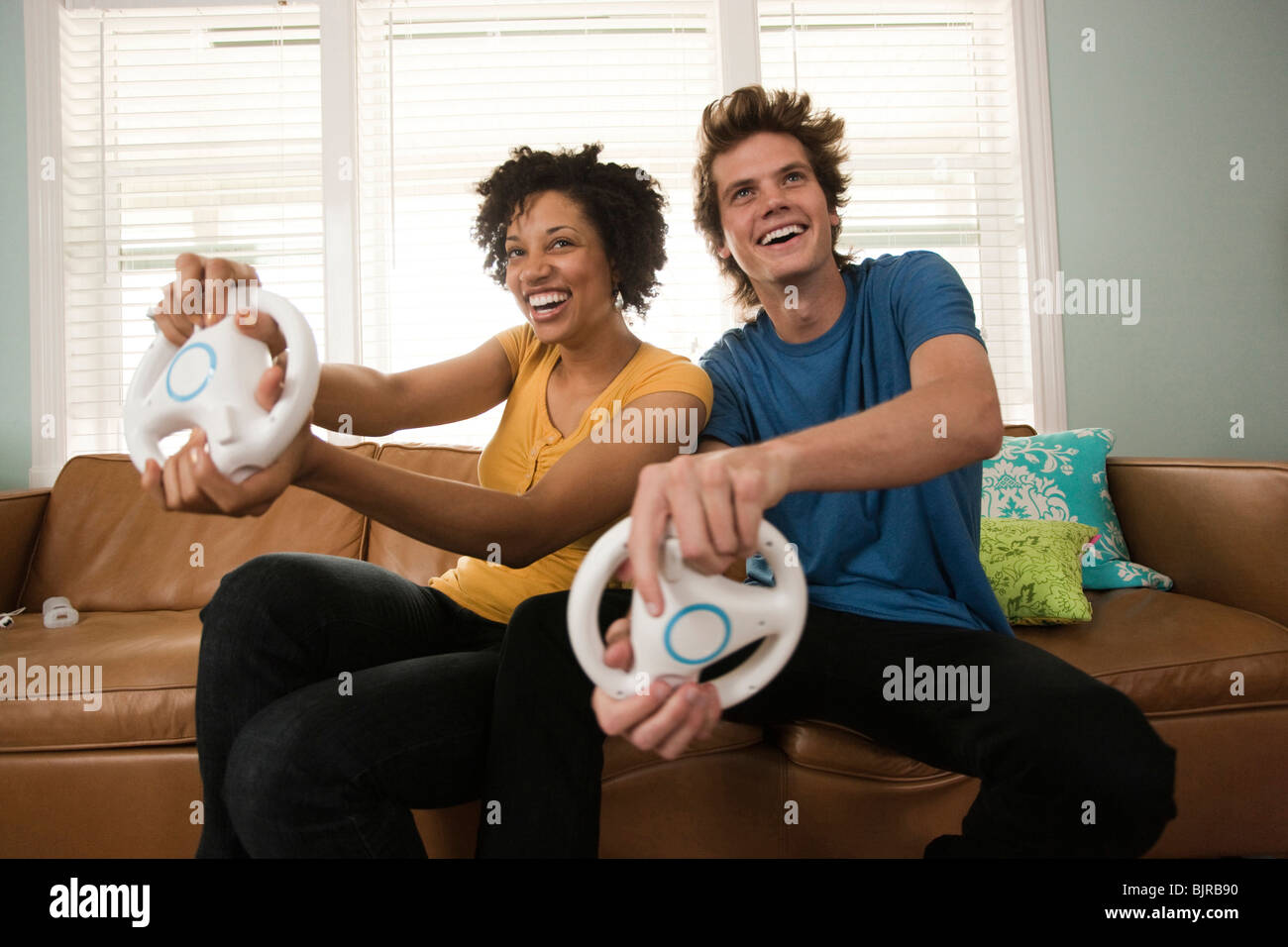 USA, Utah, Provo, young couple playing video games in living room Stock Photo