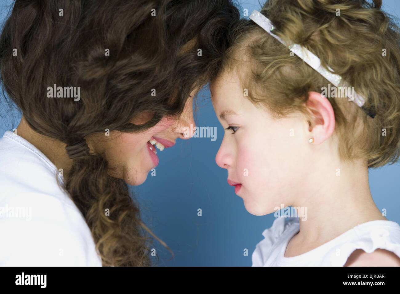Two girls rubbing noses Stock Photo Alamy