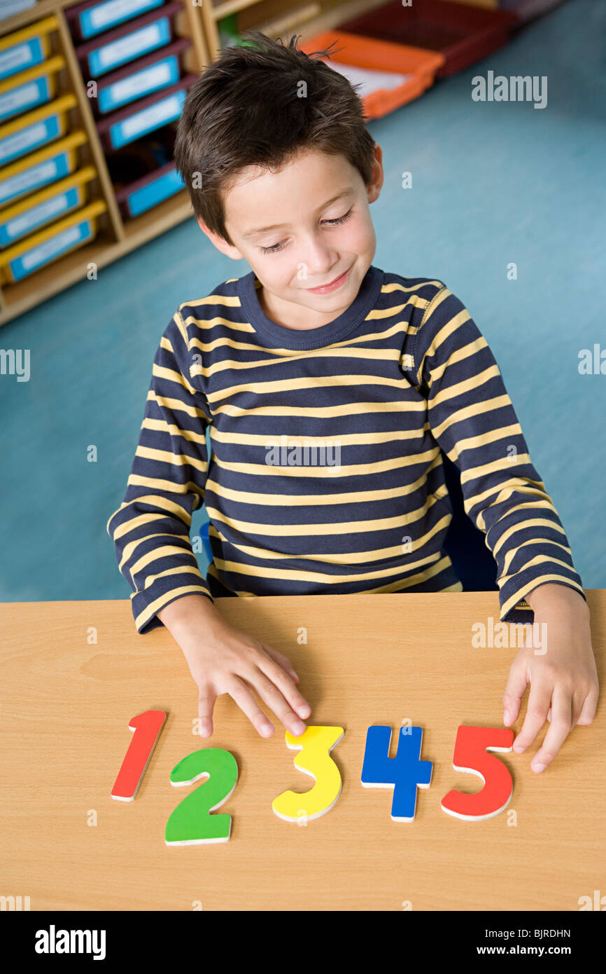 Boy learning numbers Stock Photo