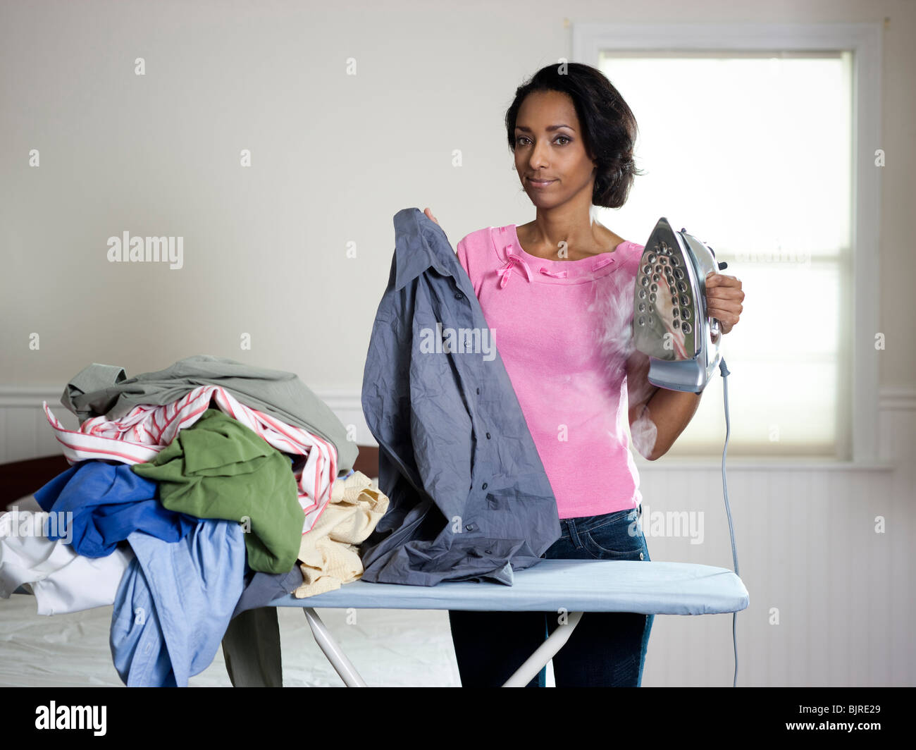 Orem, Utah, USA, mid adult woman ironing Stock Photo