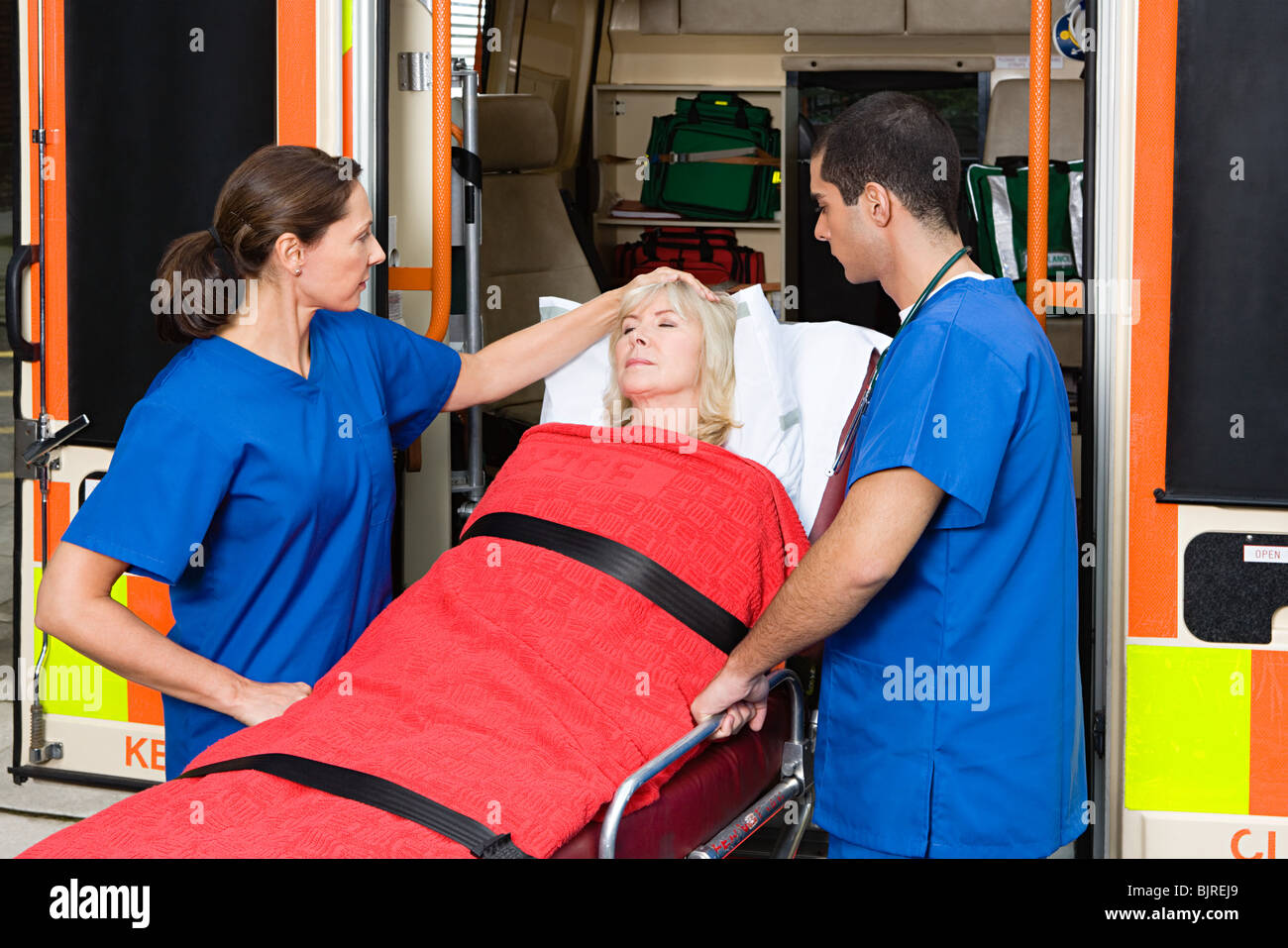 Doctors taking patient from ambulance Stock Photo Alamy