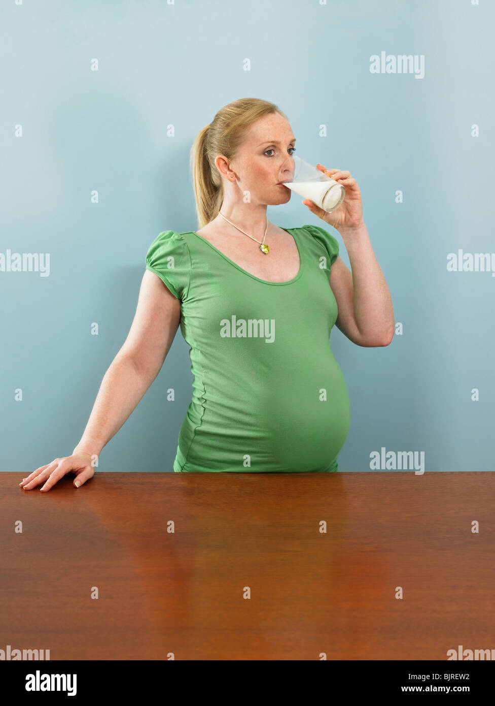 Pregnant woman drinking milk Stock Photo Alamy
