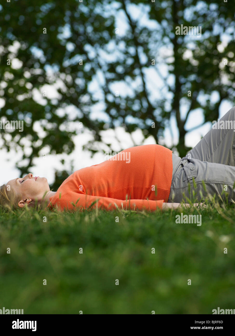 Pregnant woman lying down Stock Photo Alamy