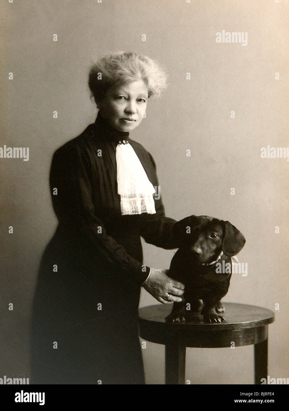 Alexandra Beketova-Blok, Russian author and translator, with her pet dog, early 19th century. Artist: Karl August Fischer Stock Photo