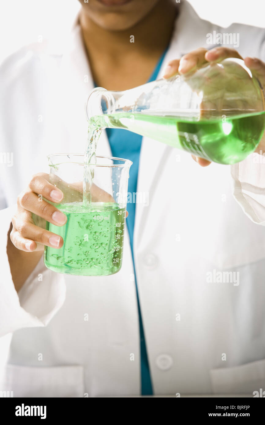 Scientist mixing chemicals Stock Photo