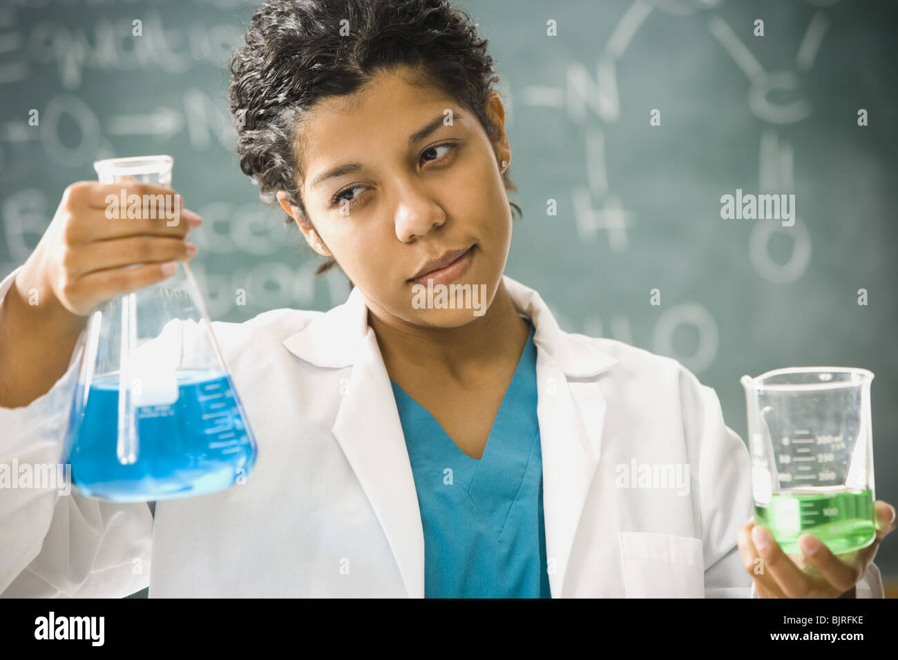 Scientist mixing chemicals Stock Photo
