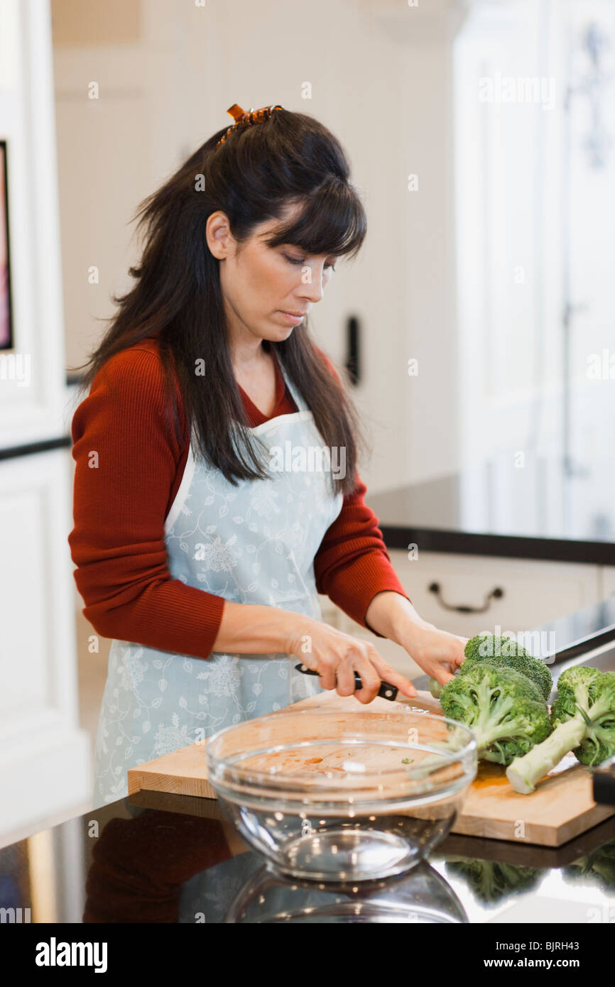 USA, Utah, Alpine, mid adult woman preparing food Stock Photo