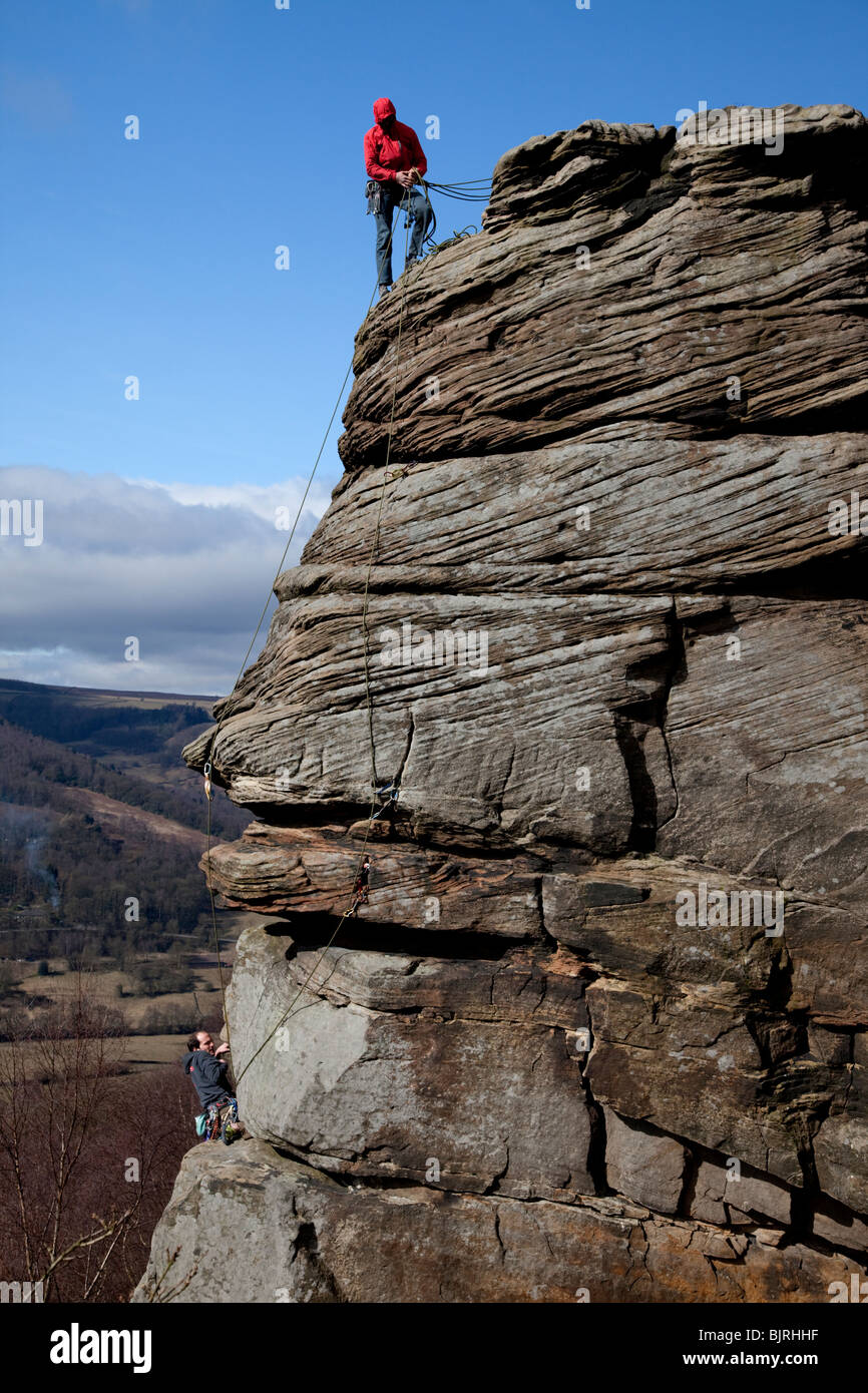 Rock climbers on Froggatt Edge in the Peak District Park Derbyshire ...