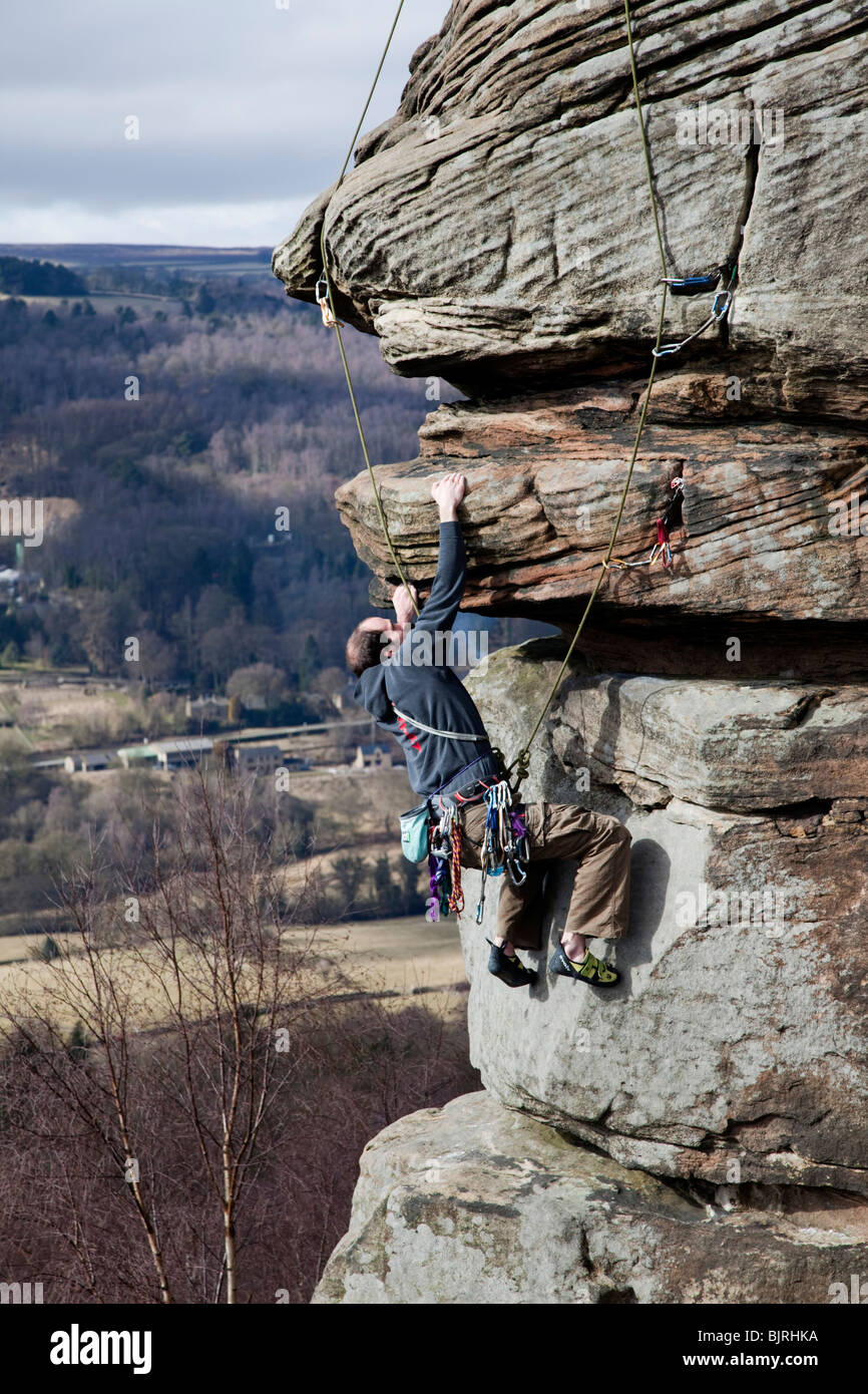 Rock climbers on Froggatt Edge in the Peak District Park Derbyshire ...