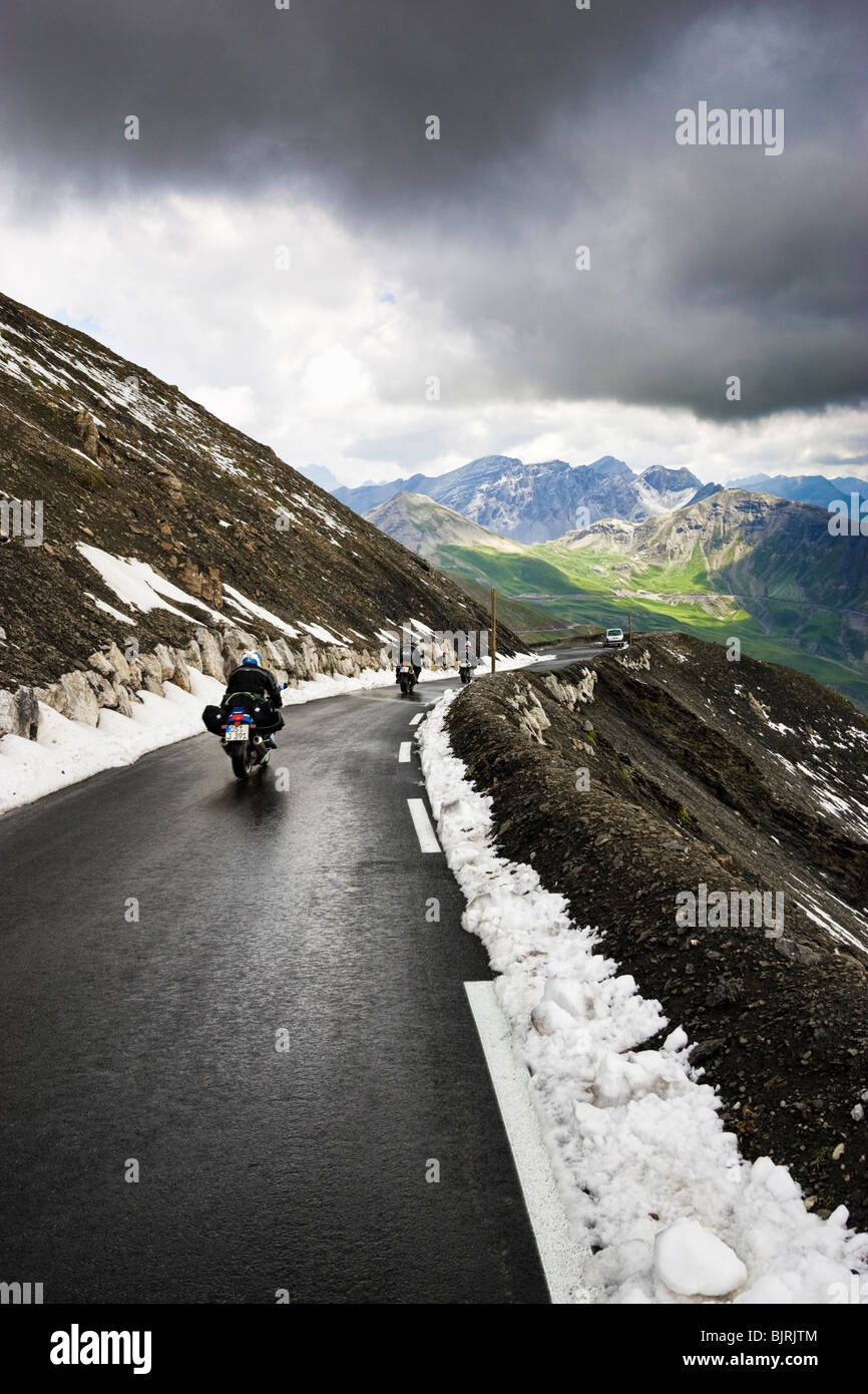 Motorcyclists touring the winding Col de la Bonette pass in the Alpes Maritimes, Provence, France Stock Photo