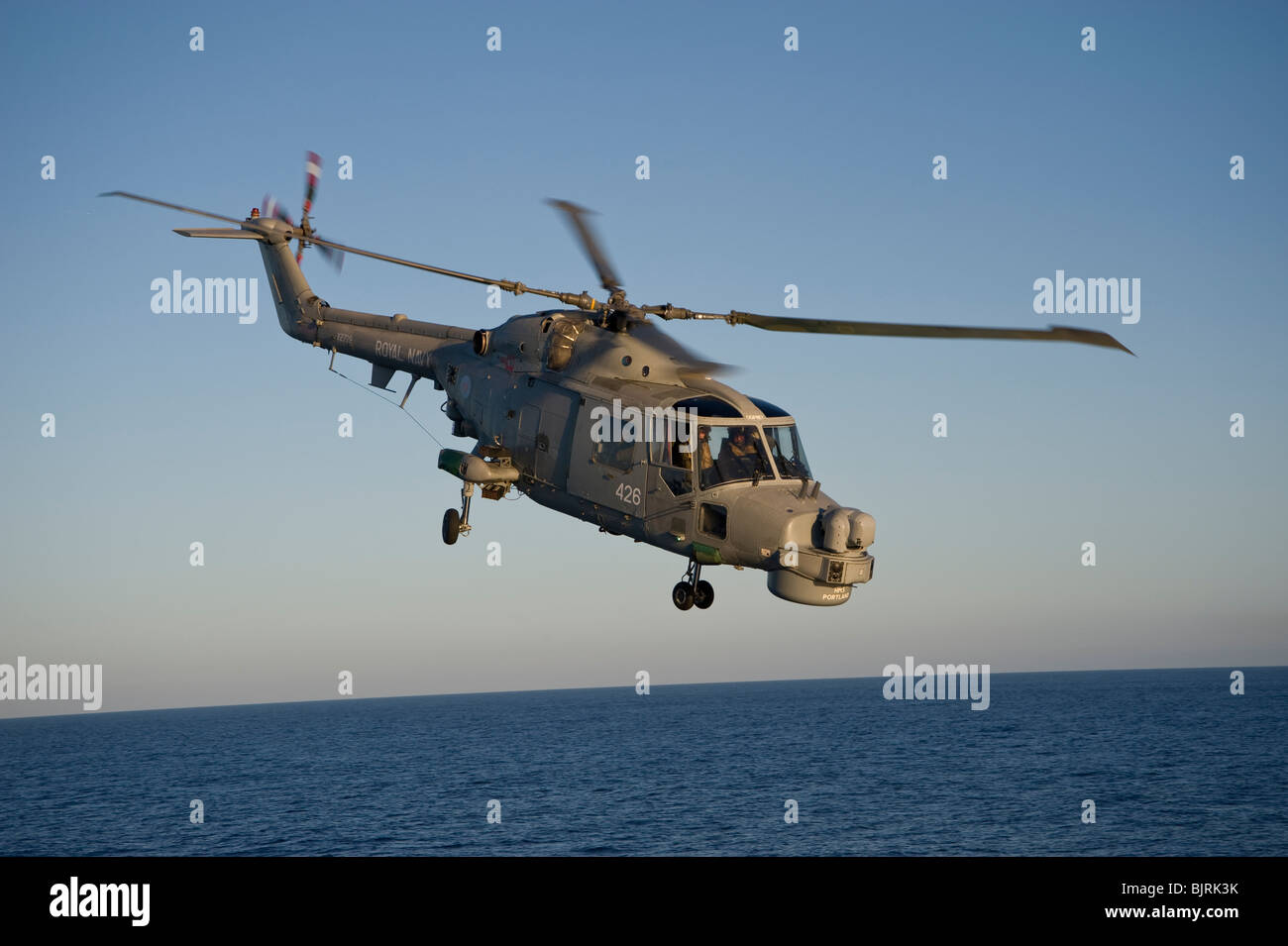 Royal Navy Mk8 Lynx helicopter in flight at sea Stock Photo