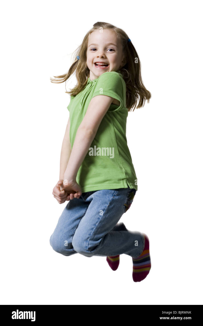 Young girl jumping in air Stock Photo