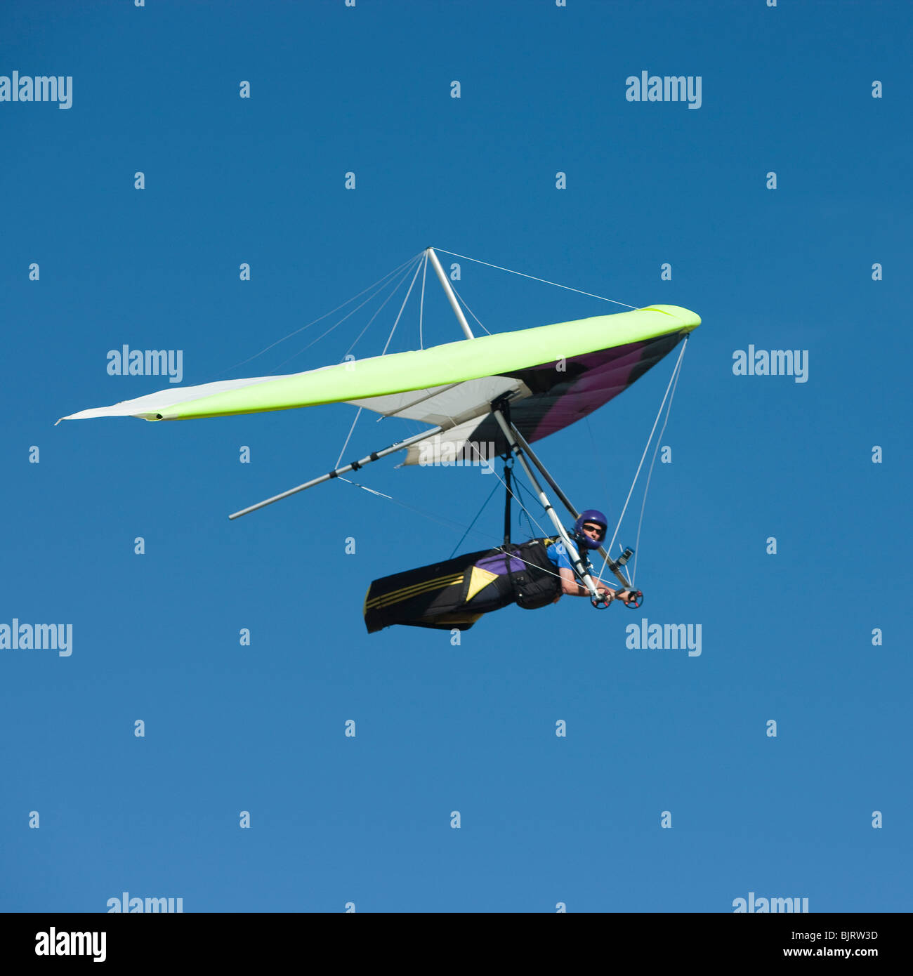 USA, Utah, Lehi, mid adult man hang gliding, low angle view Stock Photo