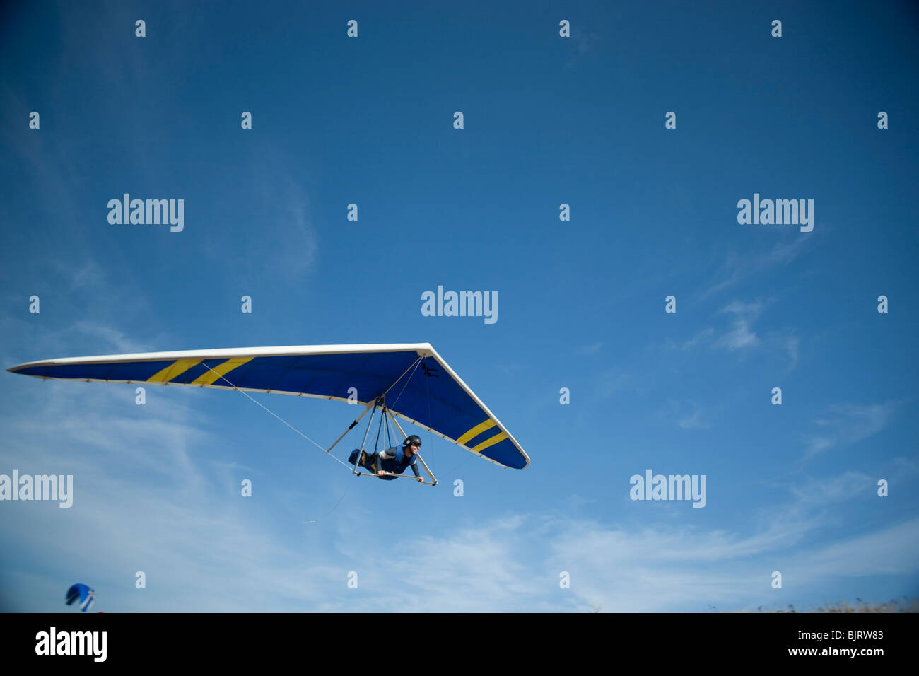 USA, Utah, Lehi, young man hang gliding, low angle view Stock Photo