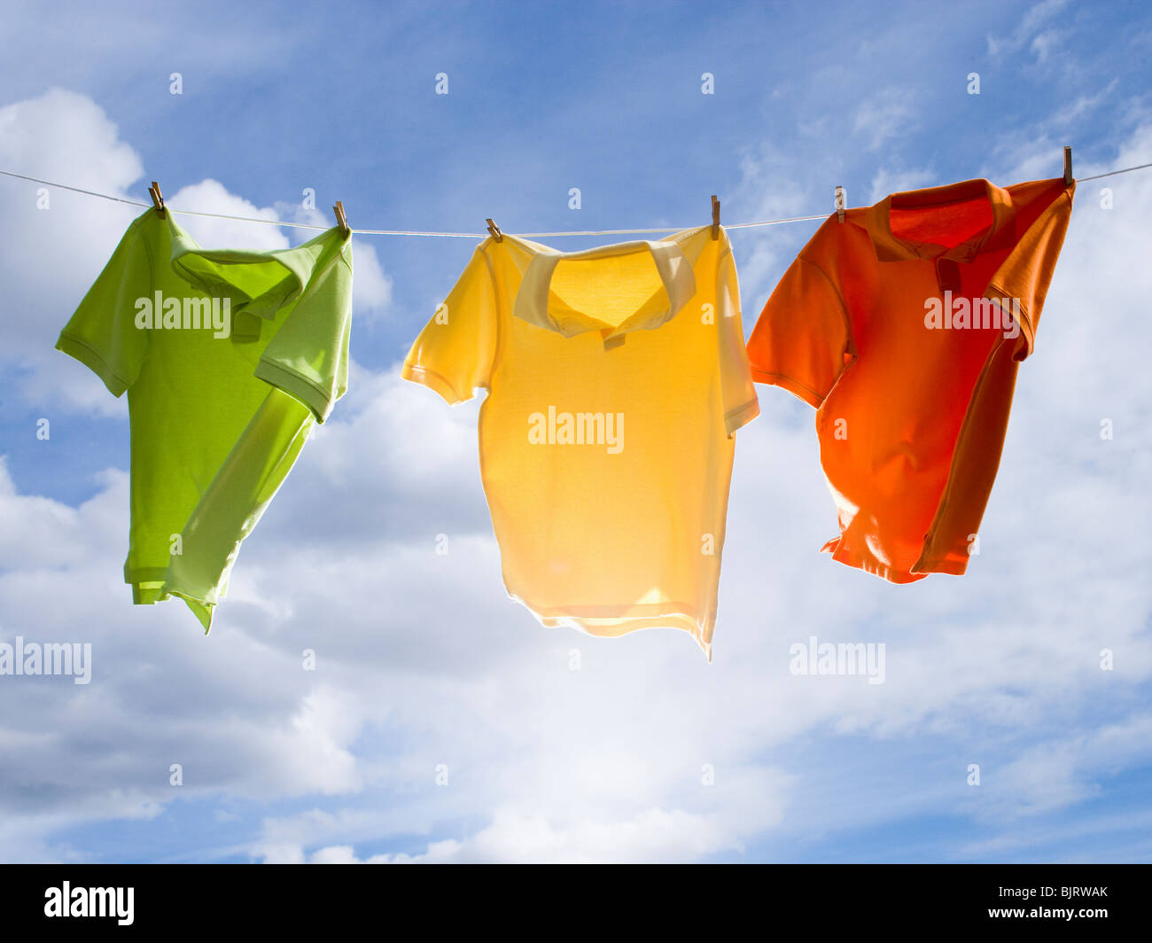 Tshirts hanging on a clothesline Stock Photo Alamy