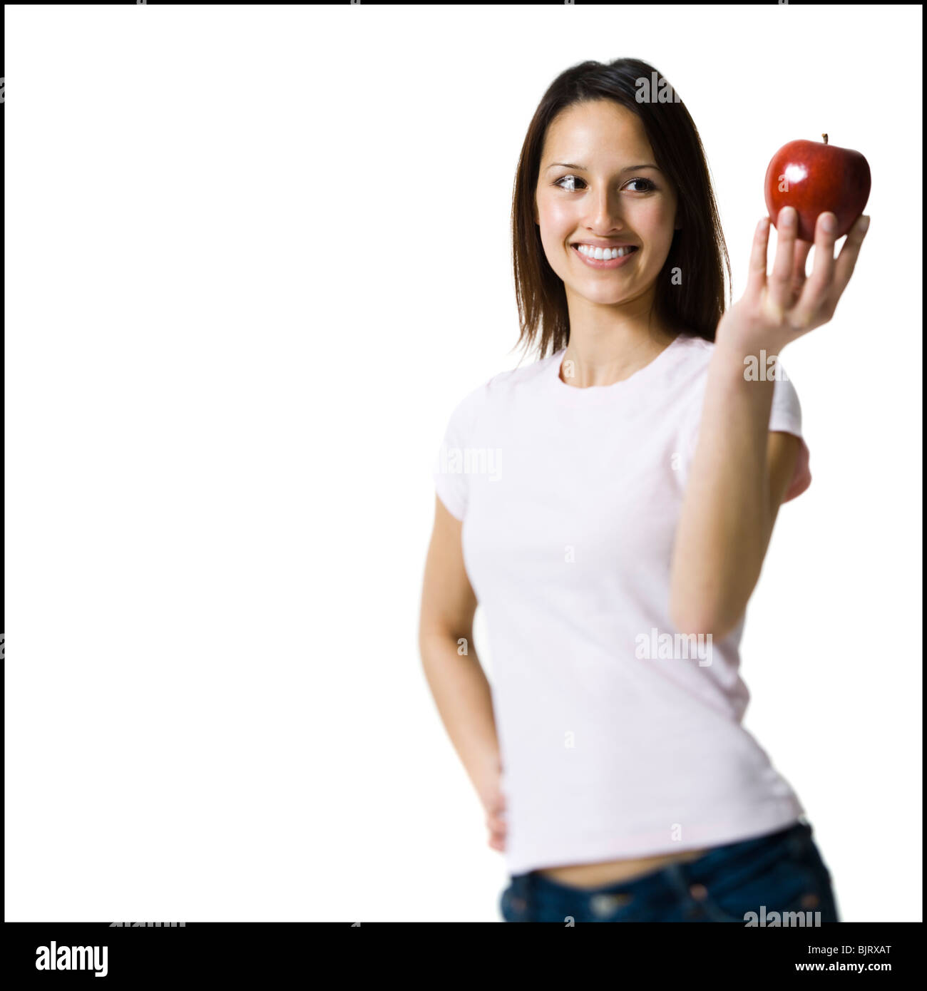 Woman holding a red apple Stock Photo
