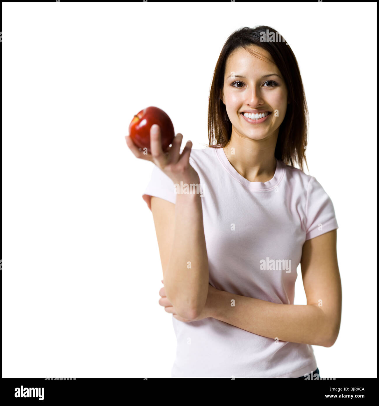 Woman holding a red apple Stock Photo