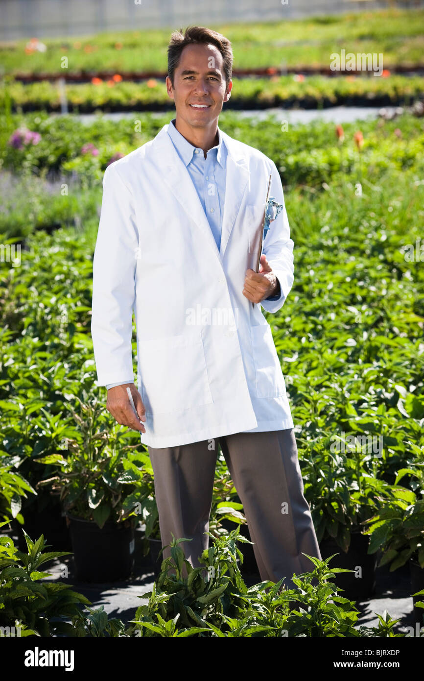 USA, Utah, Salem, portrait of scientist with clipboard in field Stock Photo