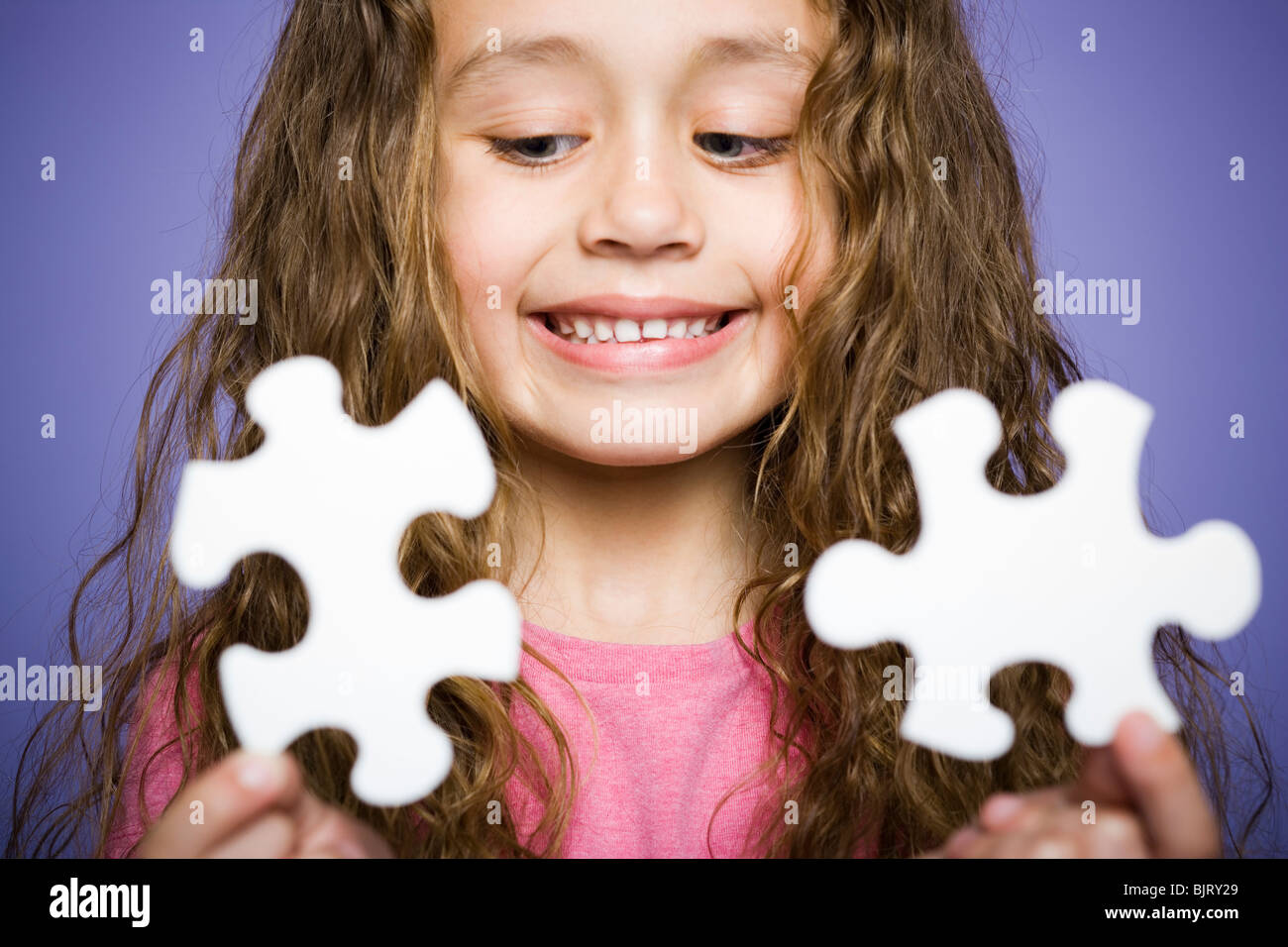 Young girl holding cookie jar Stock Photo