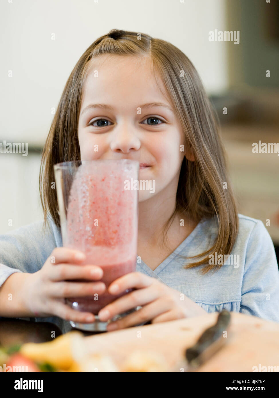 USA, Utah, Alpine, girl (8-9) holding smoothie Stock Photo
