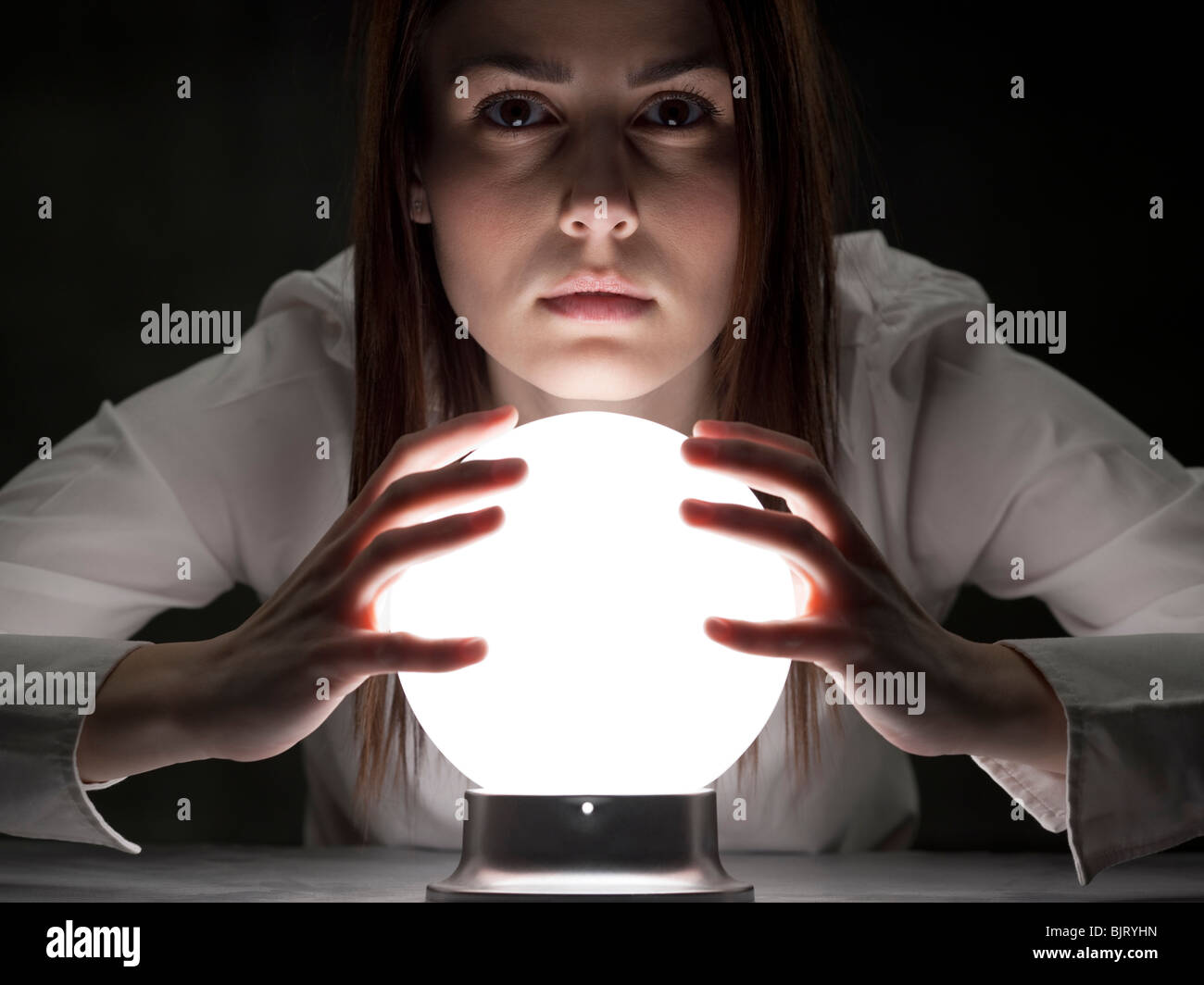 Fortune teller holding crystal ball, portrait Stock Photo Alamy