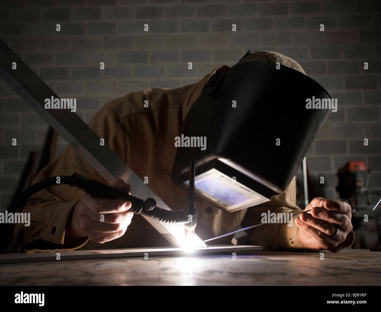 USA, Utah, Orem, welder using torch Stock Photo