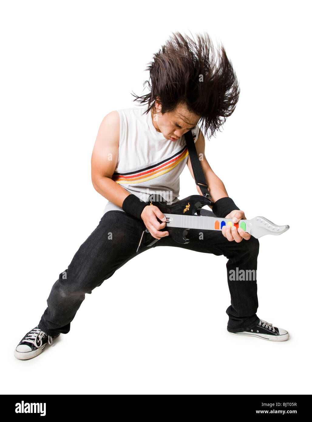 Young man playing guitar video game, portrait Stock Photo
