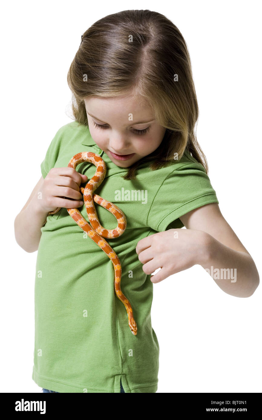 Young girl playing with a snake Stock Photo