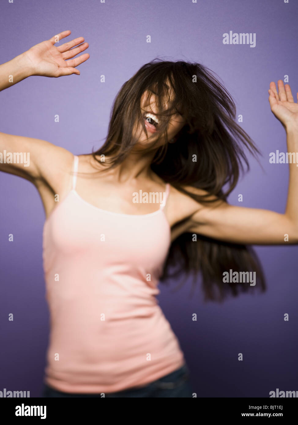 Woman flexing her biceps Stock Photo