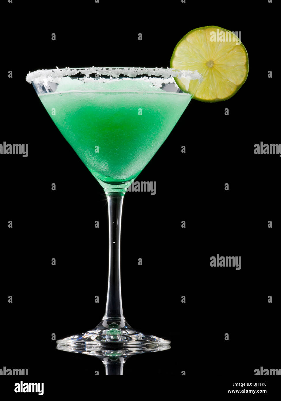 Frozen martini glass with lemon slice, studio shot Stock Photo
