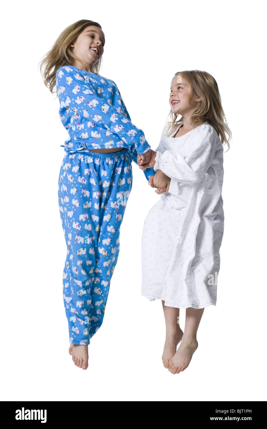 Young sisters in pajamas Stock Photo