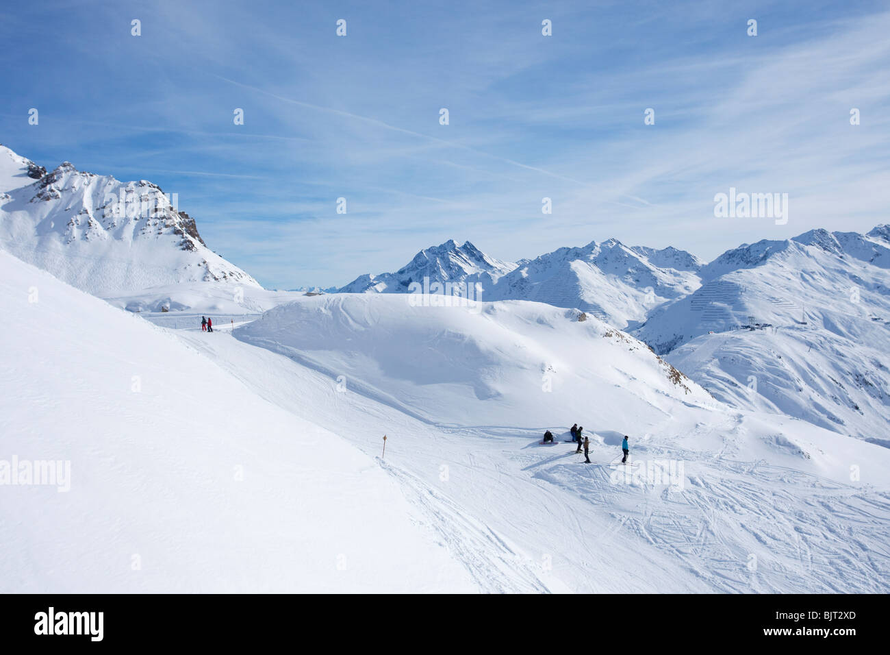 Skiers skiing in winter snow St Saint Anton am Arlberg Austrian Alps Austria Europe Stock Photo