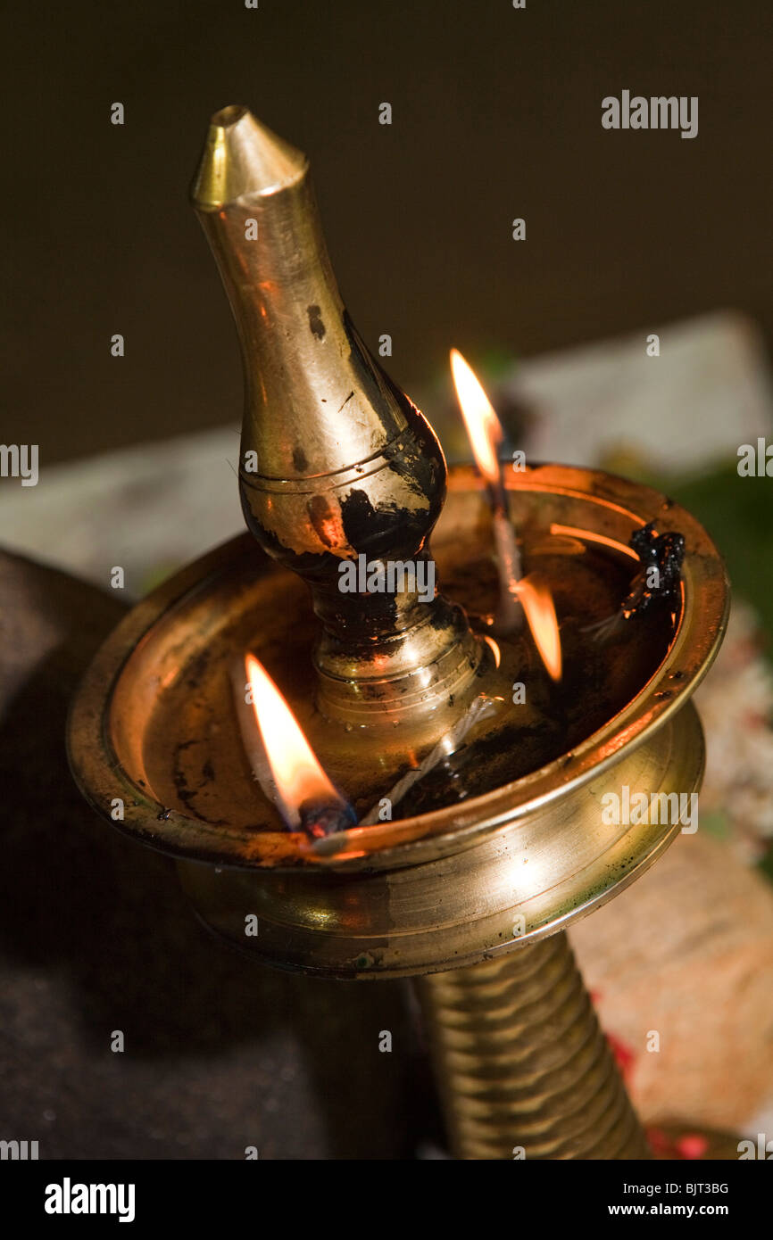 India, Kerala, Cannanore (Kannur), temple oil lamp at Theyyam, ancient pre Hindu folk art ritual Stock Photo