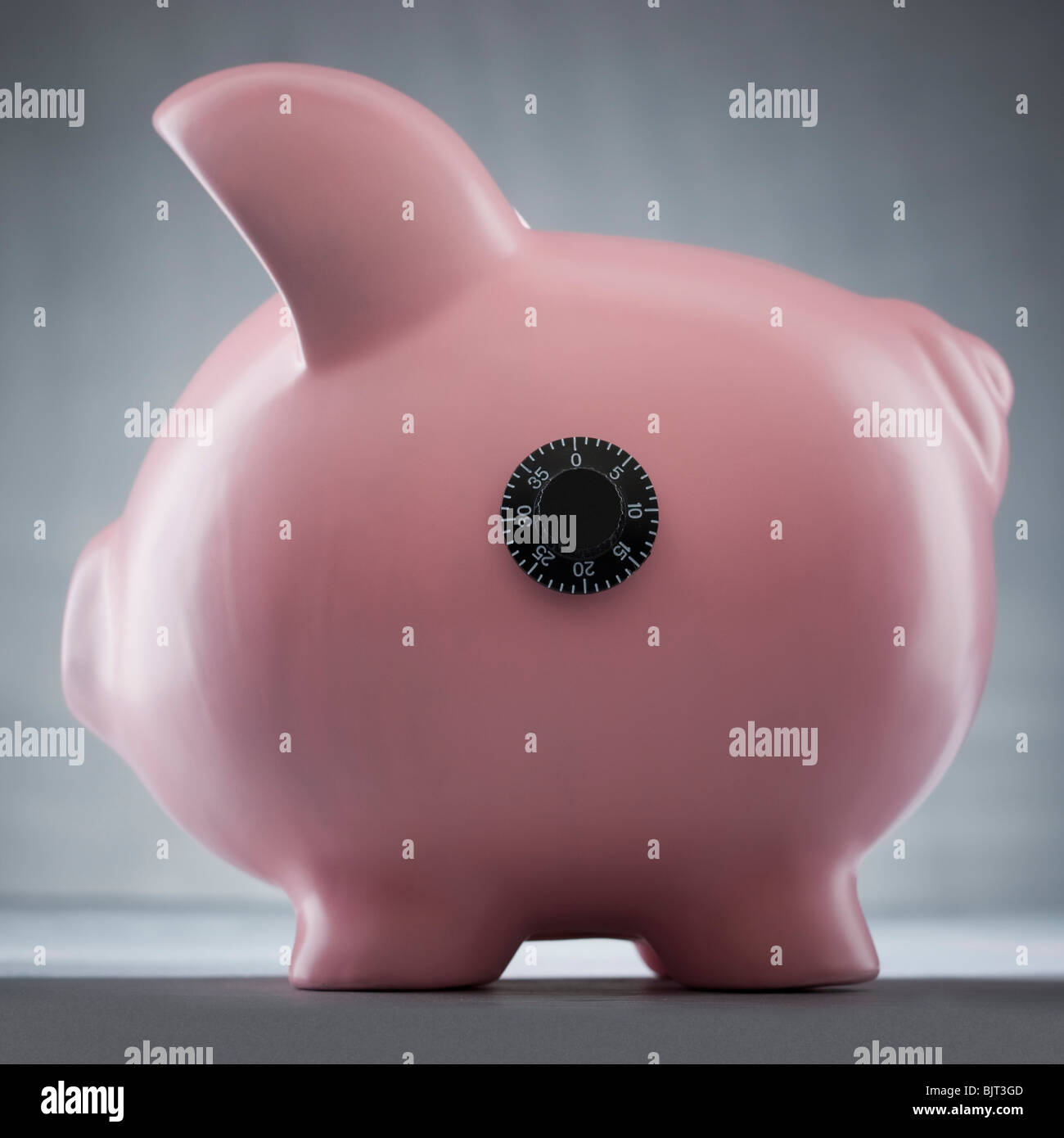Studio shot of piggy bank with combination lock Stock Photo Alamy