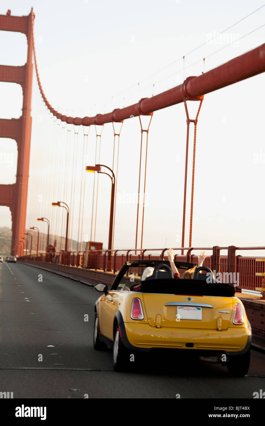 USA, California, San Francisco, yellow car on Golden Gate Bridge Stock