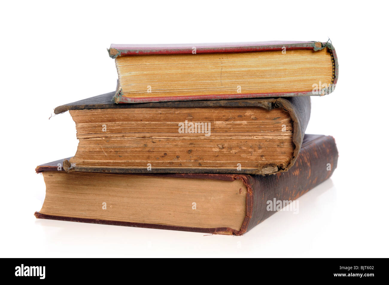 Old books in a pile isolated over white background Stock Photo