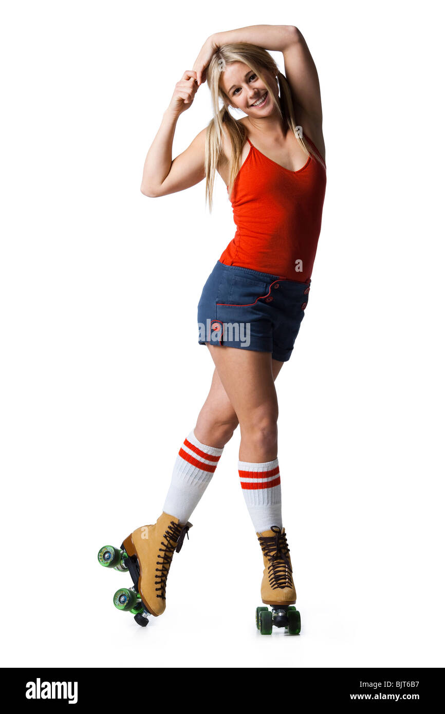 Portrait of young woman roller skating Stock Photo Alamy