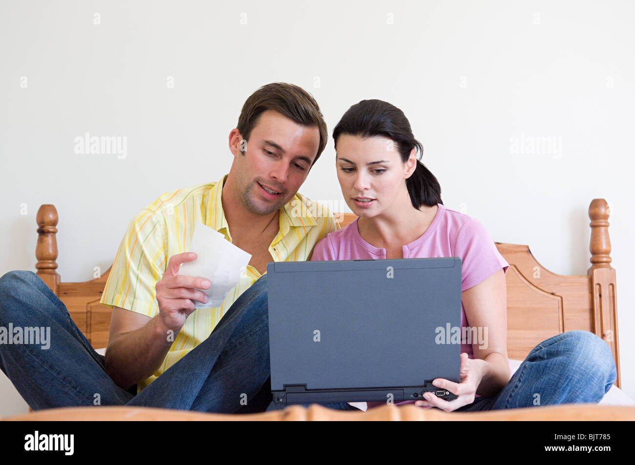 Couple with laptop Stock Photo - Alamy