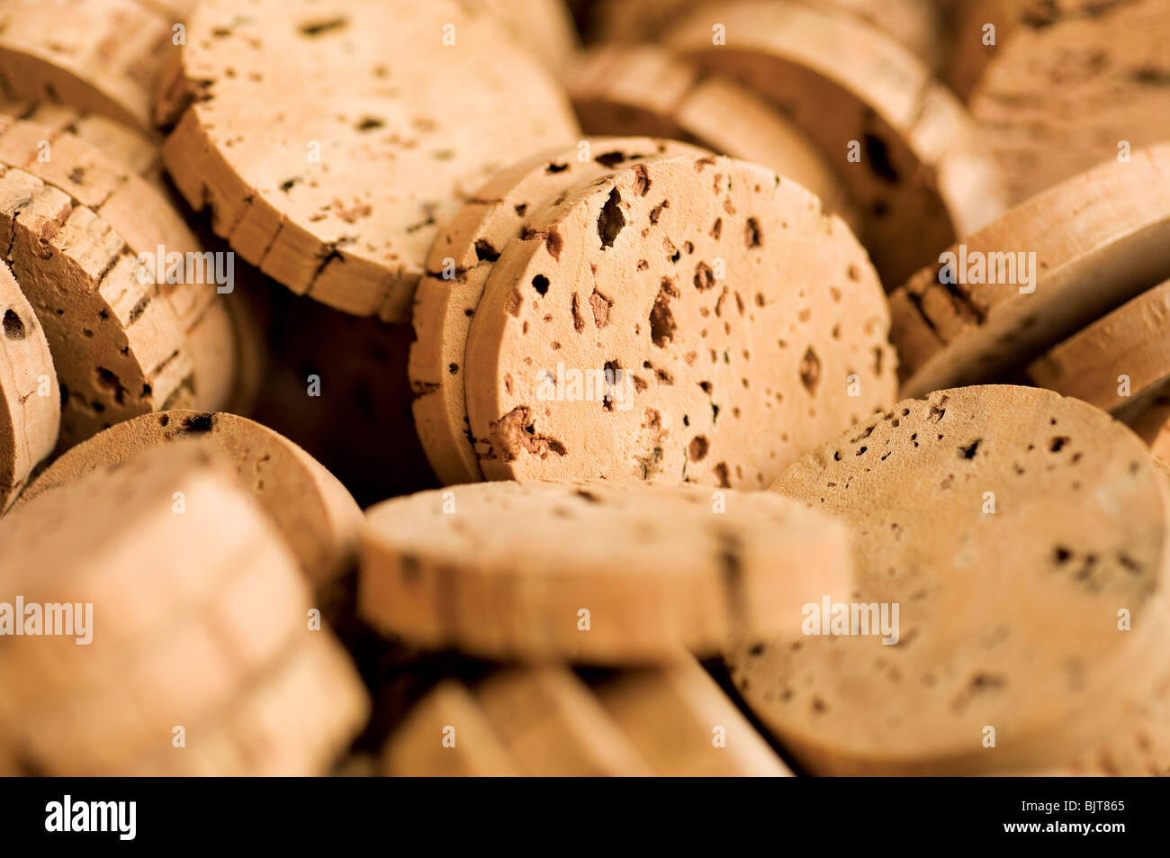 Cork disks close-up. Cork Factory S. Bras Alportel Algarve Portugal. Manual harvest of material for production of champagne wine spirits stoppers Stock Photo