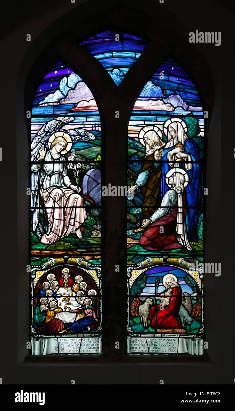 A stained glass window by William Morris & Co (1934) depicting the Three Maries at the Empty Tomb of Jesus Stock Photo