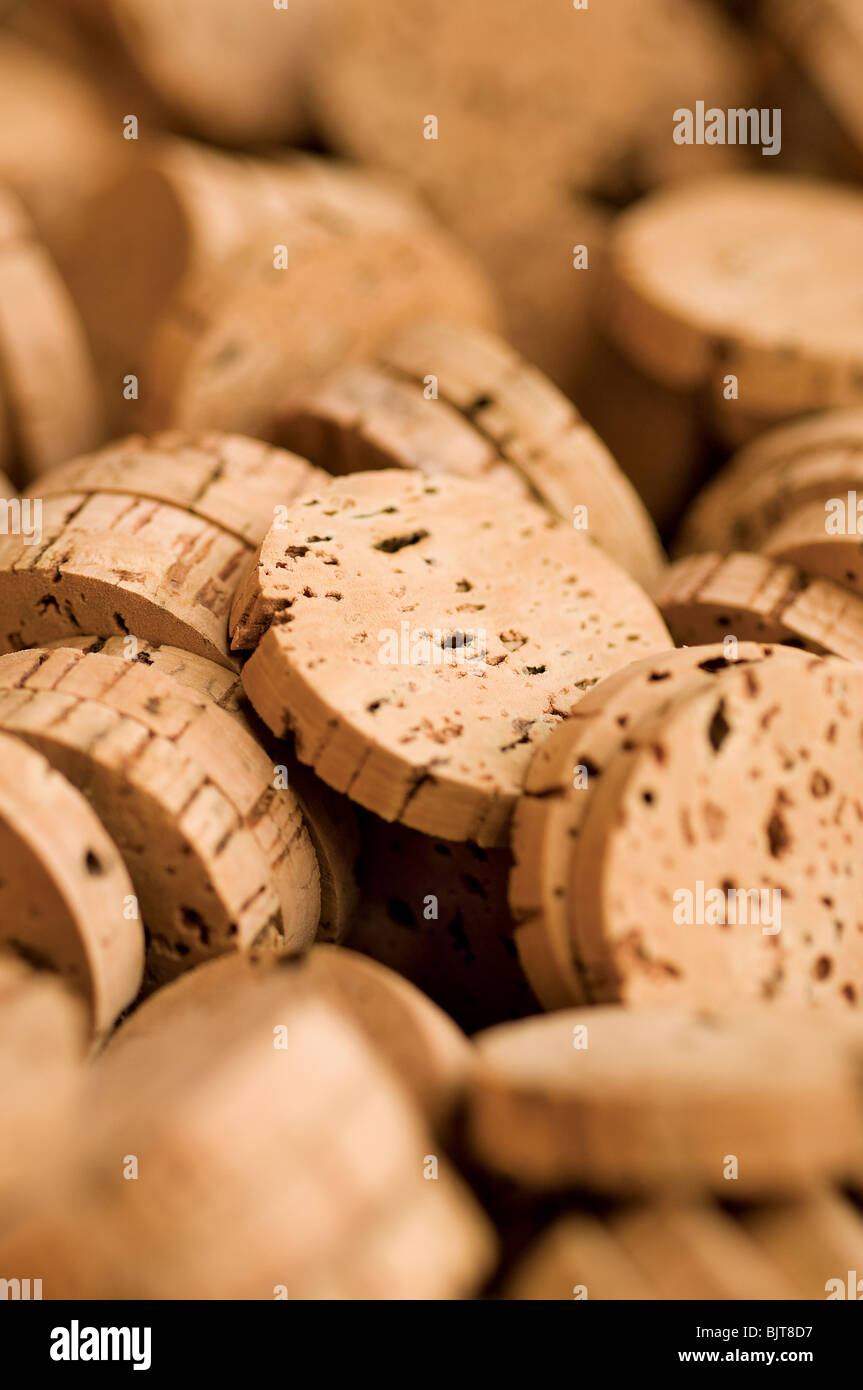 Cork disks close-up. Cork Factory S. Bras Alportel Algarve Portugal. Manual harvest of material for production of champagne wine spirits stoppers Stock Photo