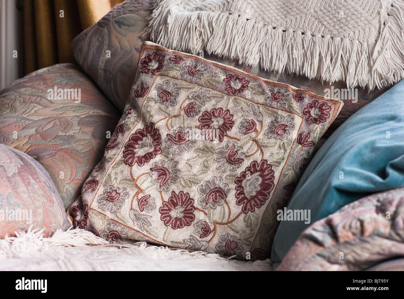 Cushions and soft furnishing on easy chair Stock Photo