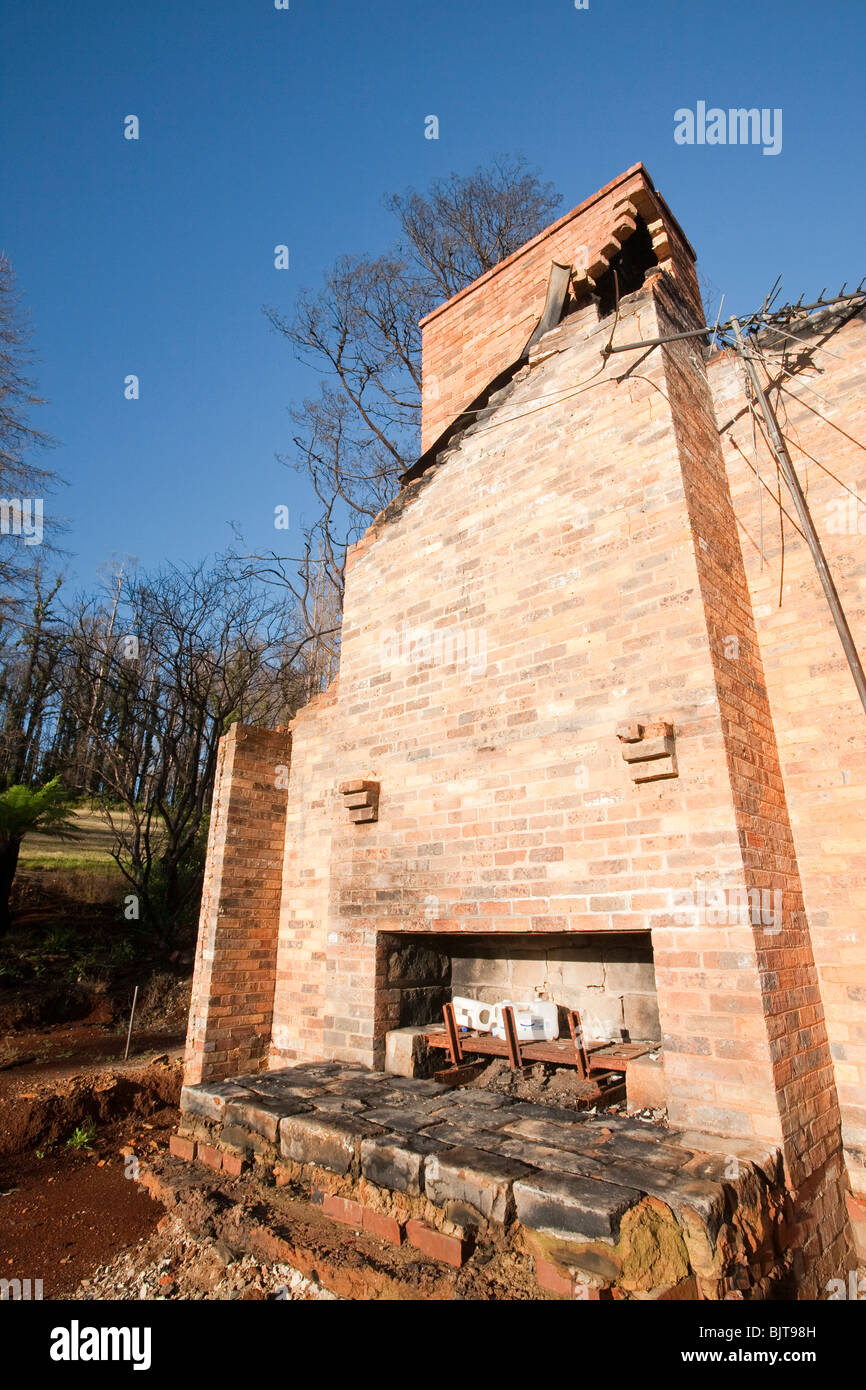 Bush fire damage in Kinglake, Victoria, Australia. The chimney stack is all that is left of this house. Stock Photo