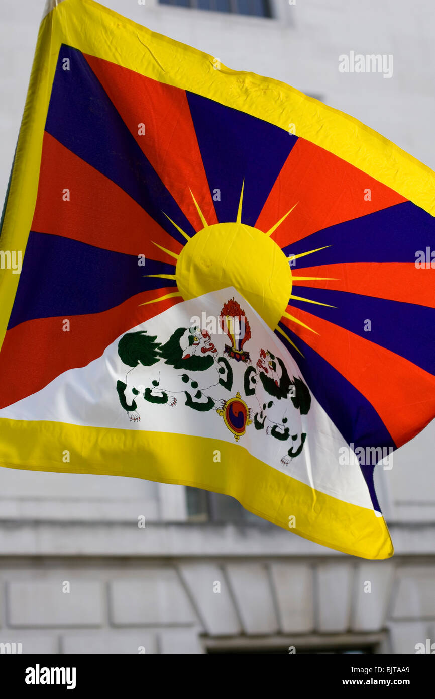 A Tibetan national flag flutters in the wind during a Tibet Freedom March protest outside the Chinese Embassy in London Stock Photo