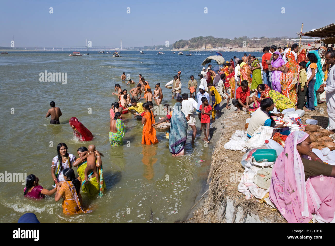 Pilgrims bathing in the sacred Ganges river. Sangam (the confluence of Ganges and Yamuna rivers). Allahabad. India Stock Photo