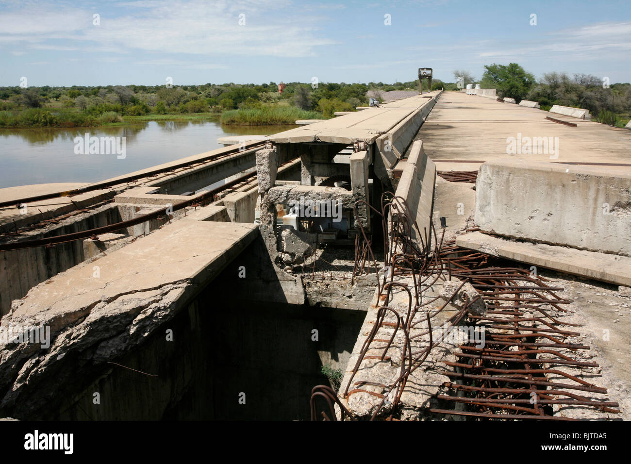 War damage remains on one of the many hydroelectric dams on the Cunene river. Cunene Province, Southern Angola, Africa. Stock Photo