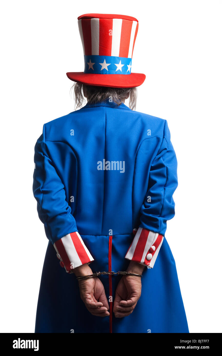 Man in Uncle Sam's costume as prisoner, studio shot Stock Photo