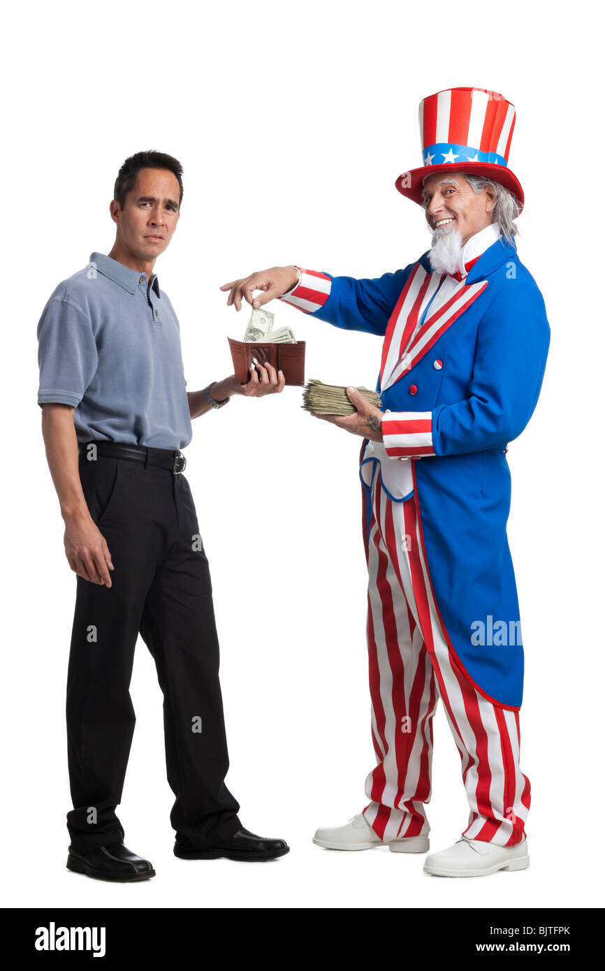 Man in Uncle Sam's costume taking money from other man, studio shot Stock Photo